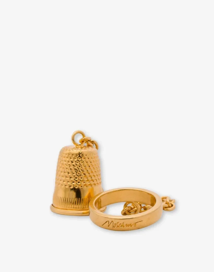 Metal ring with charm